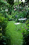 AMELIA HEATH GARDEN  1  CROSS VILLAS  SHROPSHIRE: THE SECRET GARDEN WITH LAWN  WOODEN TABLE AND CHAIRS