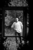 PROVENCE  FRANCE. GARDEN OF MARCO NUCERA. MARCO NUCERA SEEN THROUGH A GLASS FRAME. BLACK AND WHITE IMAGE