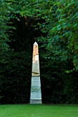 ANGEL COLLINS GARDEN: MIRRORED OBELISK LIT BY DAVID HARBER LIT UP BY THE EVENING SUN