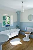 DESIGNER CLARE MATTHEWS: DEVON  BLUE AND WHITE THEMED BATHROOM WITH ROLL TOP BATH