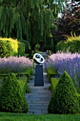 DAVID HARBER SUNDIALS: STAINLESS STEEL BEROSSOS SUNDIAL ON PLINTH IN FORMAL GARDEN WITH TOPIARY PYRAMIDS AND LAVENDER IN BOX EDGED BEDS