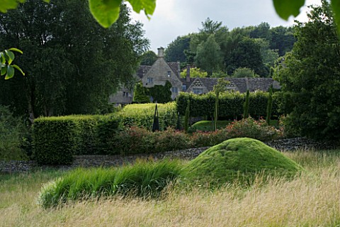 THROUGHAM_COURT__GLOUCESTERSHIRE_DESIGNER_CHRISTINE_FACER_THE_COURT_SEEN_FROM_THE_WALNUT_QUINCUNX_WI