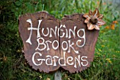 HUNTING BROOK  CO WICKLOW  REPUBLIC OF IRELAND: DESIGNER JIMI BLAKE - THE WOODEN SIGN BY THE ENTRANCE
