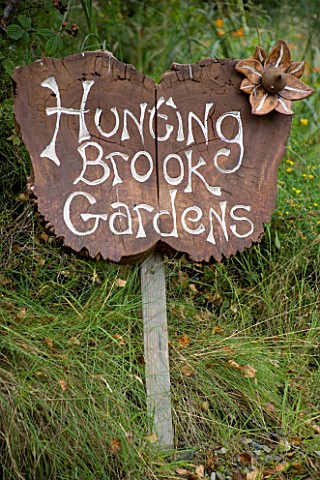 HUNTING_BROOK__CO_WICKLOW__REPUBLIC_OF_IRELAND_DESIGNER_JIMI_BLAKE__THE_WOODEN_SIGN_BY_THE_ENTRANCE