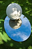 THROUGHAM COURT  GLOUCESTERSHIRE. DESIGNER: CHRISTINE FACER: THE GARDEN OF COSMIC SPECULATION - COSMIC ANCASTER STONE SPHERE & OVAL MIRROR POLISHED STAINLESS STEEL BASE. REFLECTION