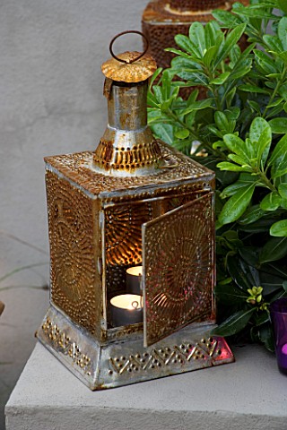 DESIGNER__CHARLOTTE_ROWE__LONDON_CHARLOTTE_ROWES_OWN_GARDEN_AT_NIGHT___ORNATE_MOROCCAN_CANDLE_HOLDER