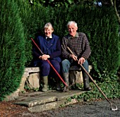 RAY AND BARBARA JOSEPH SIT ON A BENCH IN THEIR GARDEN AT THE DINGLE  WALES
