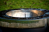 DAVID HARBER SUNDIALS: CLOSE UP OF CHALICE SUNDIAL WATER FEATURE MADE OF MIRROR POLISHED STAINLESS STEEL