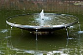 DAVID HARBER SUNDIALS: WATER FEATURE WITH DISH AND SMALL FOUNTAINS IN A LARGE POOL