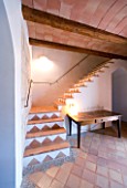 SON BERNADINET HOTEL  NEAR CAMPOS  MALLORCA. SUITE.DO. THE HALLWAY WITH STAIRCASE  TABLE AND LAMP