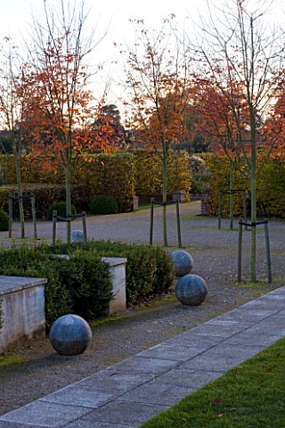 MARKS_HALL__ESSEX_AUTUMN_COLOUR_IN_THE_WALLED_GARDEN__THE_GARDEN_OF_SPHERES_WITH_STONE_BALLS__AND_AM