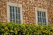 SUITE.DO. OLD WALL AND BLUE SHUTTERS. SANTANYI  MALLORCA  SPAIN