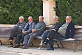 SUITE.DO. OLD MEN SITTING ON A BENCH IN THE EVENING. SES SALINAS  MALLORCA  SPAIN