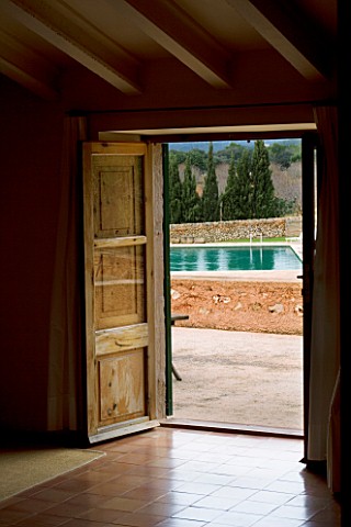 SON_BERNADINET_HOTEL__NEAR_CAMPOS__MALLORCA__SPAIN_VIEW_OF_THE_SWIMMING_POOL_THROUGH_A_BEDROOM_DOOR