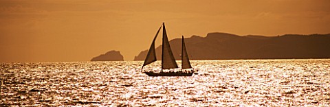SUITEDO_SHIP_SAILING_PAST_CABRERA_ISLAND_AT_SUNSET_MALLORCA__SPAIN