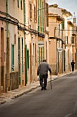SUITE.DO. OLD MAN WALKING ALONG THE STREETS. SANTANYI  MALLORCA  SPAIN
