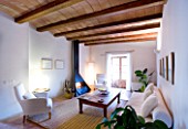 SON BERNADINET HOTEL  NEAR CAMPOS  MALLORCA. SUITE.DO. BEAUTIFUL WHITE SITTING ROOM WITH FIREPLACE