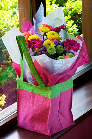PINK_BAG_WITH_CUT_FLOWERS__GREEN_AND_YELLOW_SHAMROCK_CHRYSANTHEMUMS_AND_PINK_GERBERAS