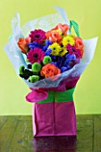 PINK BAG WITH CUT FLOWERS - GREEN AND YELLOW SHAMROCK CHRYSANTHEMUMS AND PINK GERBERAS