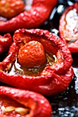 DESIGNER: CHARLOTTE ROWE  LONDON: OVEN BAKED RED PEPPERS ON A BAKING TRAY