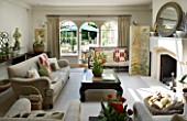 DESIGNERS SUE AYLETT: SUE AYLETTS HOUSE  LONDON: THE LIVING ROOM WITH VIEW OUTSIDE TO THE GARDEN