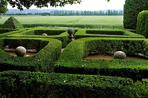 PROVENCE__FRANCE__ALTAVES_BOX_TOPIARY_GARDEN_WITH_SPHERICAL_ORNAMENTAL_STONE_SCULPTURE