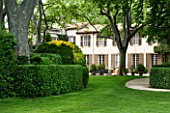 PROVENCE  FRANCE - ALTAVES GARDEN. LAWN AND CLIPPED HEDGES IN FRONT OF HOUSE