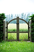 PROVENCE  FRANCE - ALTAVES.  BEAUTIFUL WOODEN GATE LEADING TO COUNTRYSIDE BEYOND