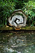 PROVENCE  FRANCE - ALTAVES. WOODEN SCULPTURE BY MARC NUCERA REFLECTED IN POND