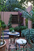CHELSEA 2008: DESIGNER CHRIS ODONOGHUE. SPANAS COURTYARD REFUGE: MOROCCAN STYLE MEDITERRANEAN COURTYARD WITH TILED FOUNTAIN AND STEPS