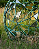 DAVID HARBER SUNDIALS: THE NUAGE - BRONZE SPHERE IN THE MEADOW AT PETTIFERS  OXFORDSHIRE - DETAIL OF GOLD PETALS