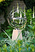 DAVID HARBER SUNDIALS: STAINLESS STEEL ARMILLARY SPHERE SUNDIAL ON A STONE PLINTH AT PETTIFERS  OXFORDSHIRE