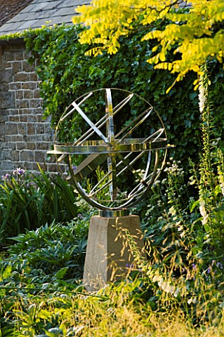 DAVID_HARBER_SUNDIALS_STAINLESS_STEEL_ARMILLARY_SPHERE_SUNDIAL_ON_A_STONE_PLINTH_AT_PETTIFERS__OXFOR