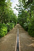 LA NORIA  FRANCE. GARDEN DESIGNED BY ARNAUD MAURIERES AND ERIC OSSART - THE ALLEE DES CYPRES - ISLAMIC STYLE WATER GARDEN - RILL