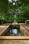 LA NORIA  FRANCE. GARDEN DESIGNED BY ARNAUD MAURIERES AND ERIC OSSART - THE CLOITRE DES MICOCOULIERS - ISLAMIC STYLE WATER GARDEN - WATER BASIN  RILL AND TREES