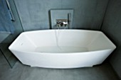 TANIA LAURIE  LONDON. STYLISH  CONTEMPORARY BATH IN SLATE TILED BATHROOM