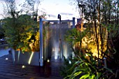 CONTEMPORARY FORMAL ROOF TERRACE/ GARDEN DESIGNED BY DATA NATURE ASSOCIATES: MODERN METAL SHOWER LIT AT NIGHT WITH METAL BEAD SCREEN AND DECKING