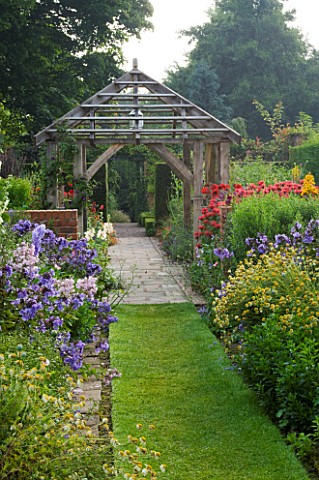 WOLLERTON_OLD_HALL__SHROPSHIRE_VIEW_FROM_ALICES_GARDEN_WITH_DAISY_BORDERS_TOWARDS_OAK_GAZEBO_WITH_PH