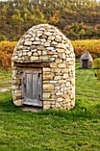 PROVENCE  FRANCE: DOMAINE DE LA VERRIERE: VINEYARDS AND THE STONE WELL HOUSE