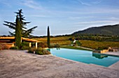 PROVENCE  FRANCE: DOMAINE DE LA VERRIERE: THE SWIMMING POOL WITH VINEYARDS AND VIEW ONTO MOUNT VENTOUX