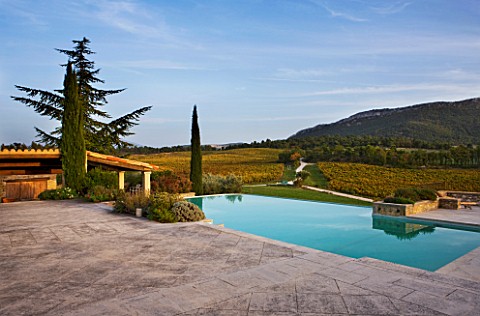 PROVENCE__FRANCE_DOMAINE_DE_LA_VERRIERE_THE_SWIMMING_POOL_WITH_VINEYARDS_AND_VIEW_ONTO_MOUNT_VENTOUX