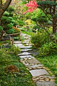GARDEN OF ERIK BORJA  FRANCE: JAPANESE/ ASIAN STYLE - STONE PATHWAY THOUGH JAPANESE GARDEN WITH BAMBOO EDGING AND CLIPPED PINES