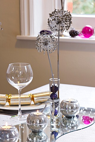 CLARE_MATTHEWS_CHRISTMAS_HOUSE_INTERIOR_TABLE_WITH_SILVER_CANDLES_ON_MIRROR__GLASS_WITH_BAUBLES_AND_
