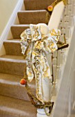 CLARE MATTHEWS CHRISTMAS HOUSE INTERIOR: DECORATIONS ON THE STAIRS IN THE HALLWAY