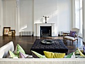 DESIGNER: JOHN MINSHAW - THE SITTING ROOM WITH SETTEE  CUSHIONS AND FIREPLACE