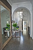 DESIGNER: JOHN MINSHAW - THE HALLWAY WITH MASSIVE MIRROR  HYACINTHS  ROSES  STAIRCASE AND LIBRARY