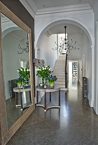 DESIGNER_JOHN_MINSHAW__THE_HALLWAY_WITH_MASSIVE_MIRROR__HYACINTHS__ROSES__STAIRCASE_AND_LIBRARY