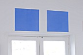 ROSE GRAY AND SCULPTOR DAVID MACILWAINE: BLUE PAINTED SQUARES ABOVE THE WINDOW