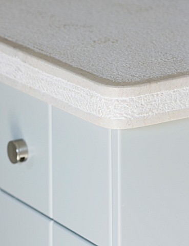 DESIGNER_CLAIRE_SKINNER__ROU_ESTATE__CORFU_KITCHEN__DETAIL_OF_SIDEBOARD_TOP_AND_DRAWER_WITH_METAL_KN