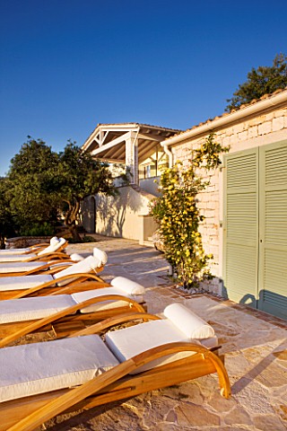 PRIVATE_VILLA__CORFU__GREECE_DESIGN_BY_ALITHEA_JOHNS__DECKCHAIRS_BESIDE_THE_SWIMMING_POOL